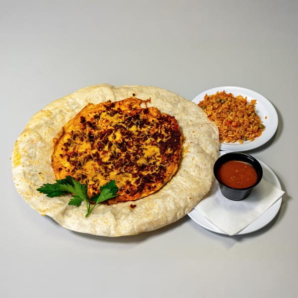 Breakfast burrito with chorizo and cheese, served with rice and salsa at Cherry Pit Cafe.